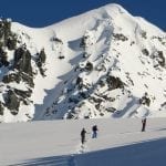 Skiers approach Peak 8100